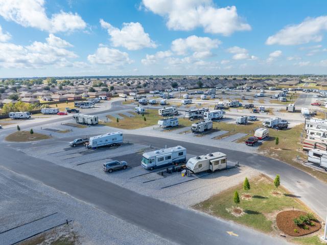 Aerial view of The Gates at McNeese RV Park with RVs on paved pads