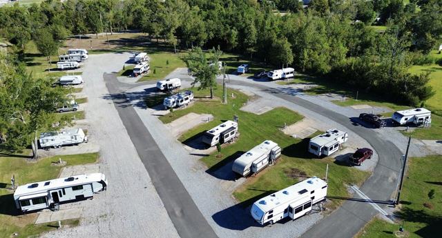 Aerial view of Rustic Oak RV Park with RVs on grassy and gravel sites